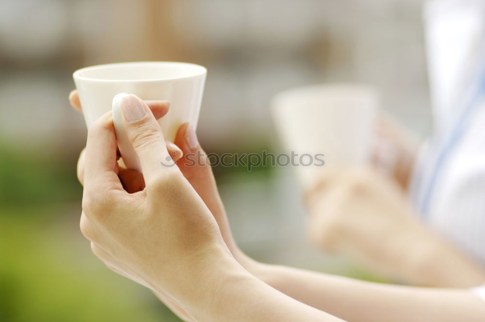 Similar – Image, Stock Photo Hand hold very small cup of coffee.