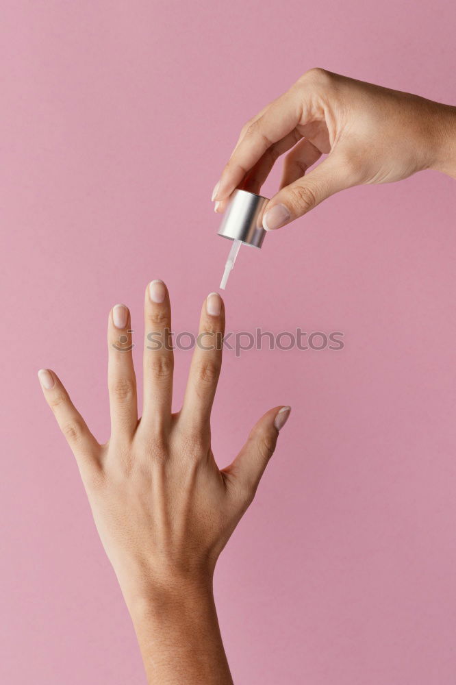 Similar – Female hand with red painted fingernails holding a bottle of red nail polish