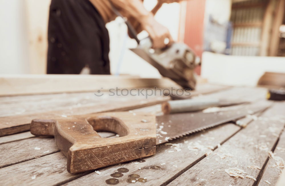 Similar – Image, Stock Photo Carpenter works with a chisel and a hammer.