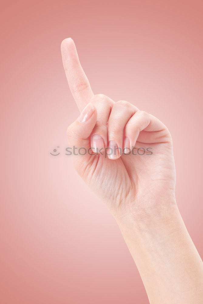 Similar – Forearm, hand and index finger against a yellow background