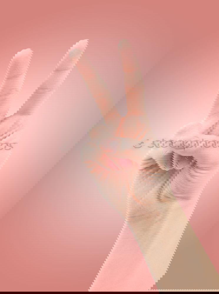 Similar – Image, Stock Photo Hand signal for peace against a yellow background