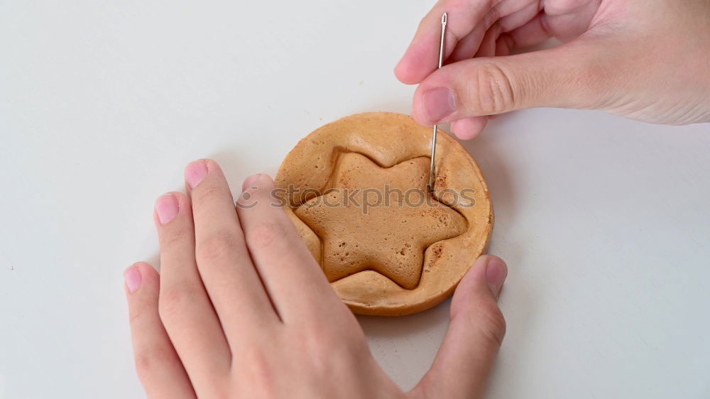 Image, Stock Photo Woman hands cutting a pumpkin pie. Purple background.