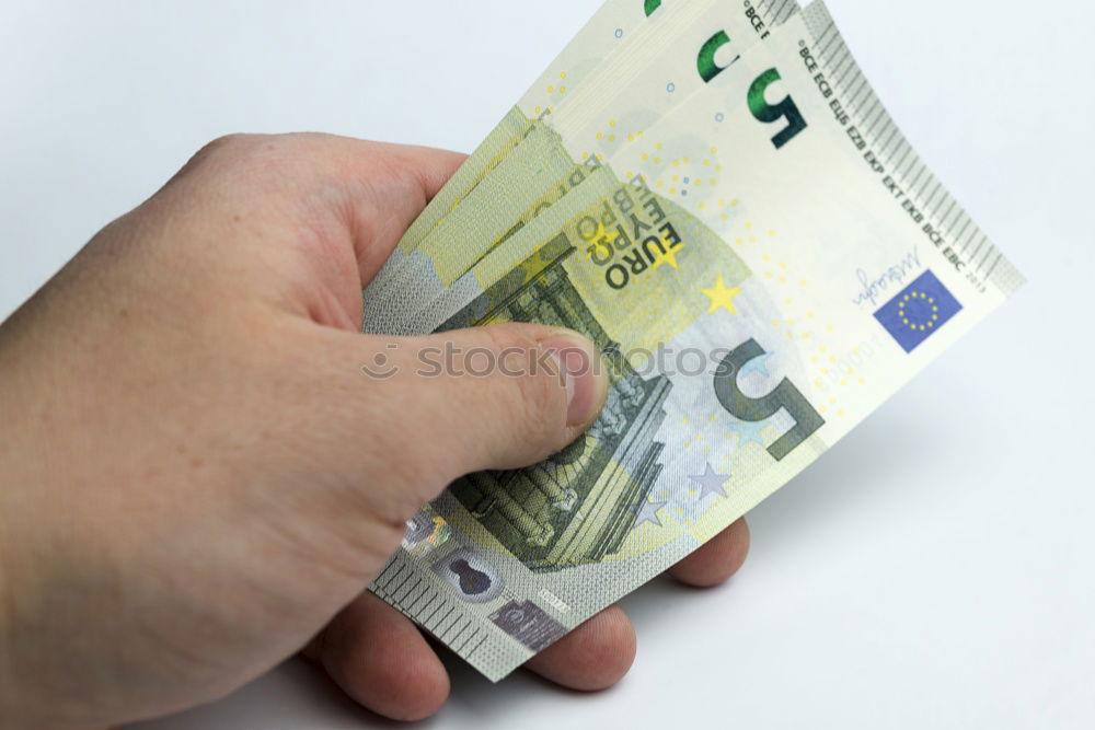 Similar – Image, Stock Photo Payday | hands of a young woman and many banknotes standing on the table before her.