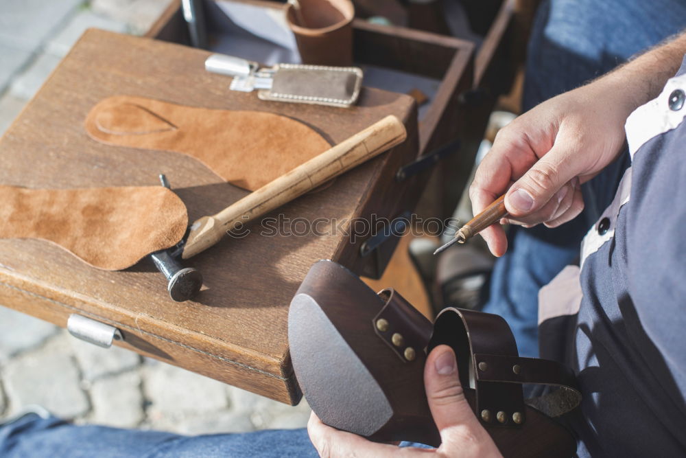 Similar – Hands making shoes