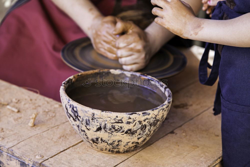 Similar – Image, Stock Photo Close-up of clay vase on wheel