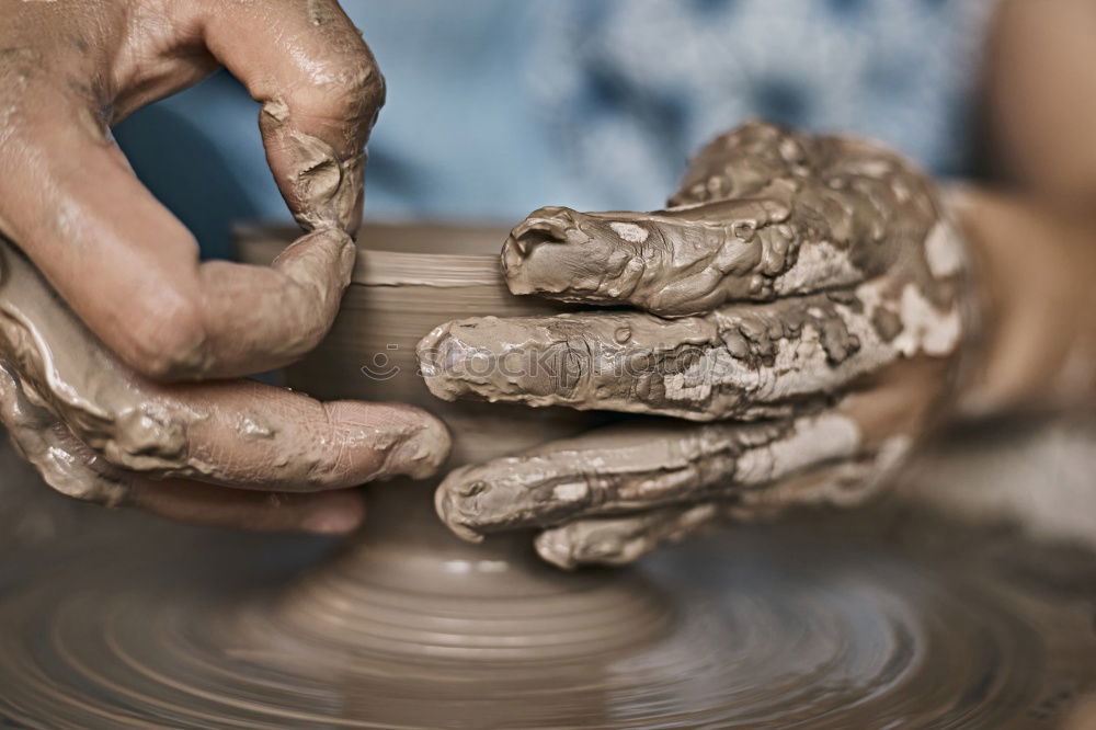 Potter working with clay