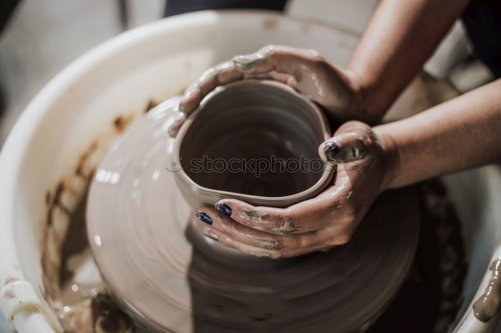 Similar – Image, Stock Photo Woman working with clay making pot