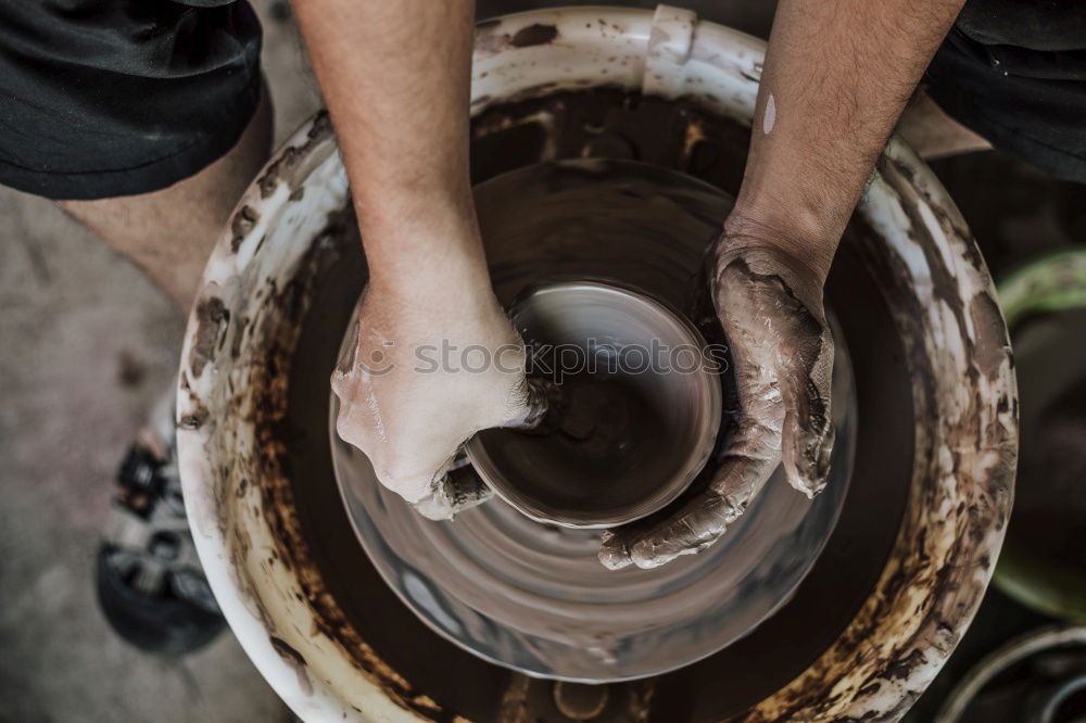 Similar – Blacksmith forges iron on anvil