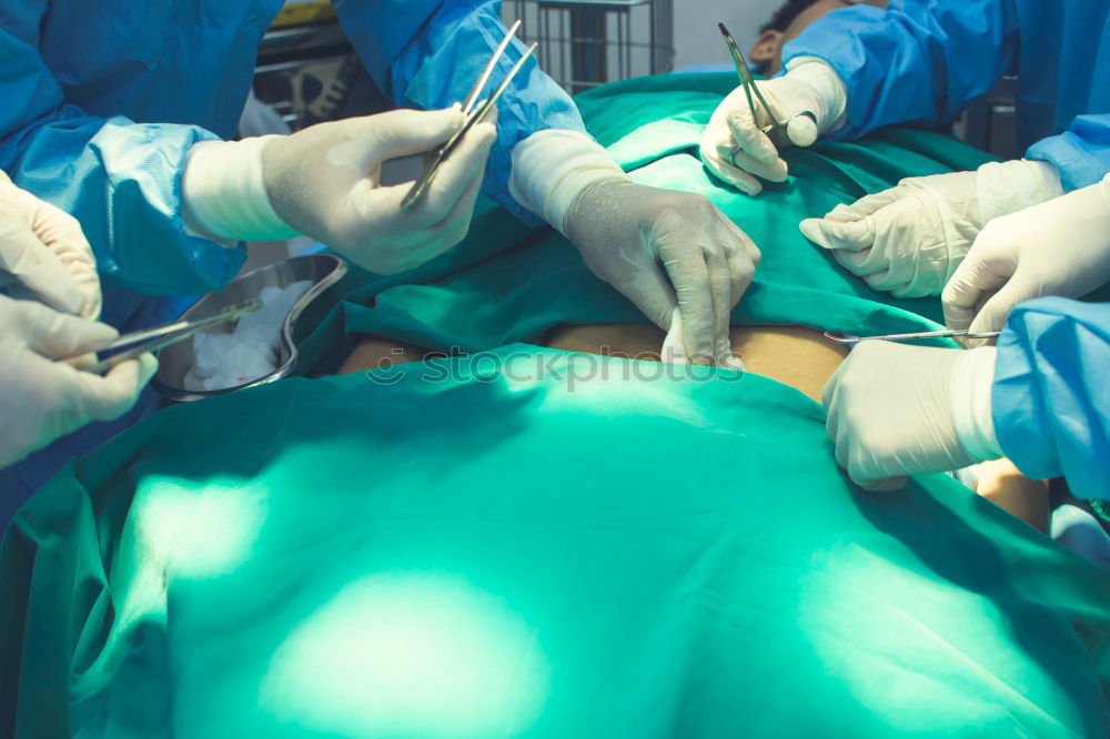 Image, Stock Photo Team of Surgeons Operating.