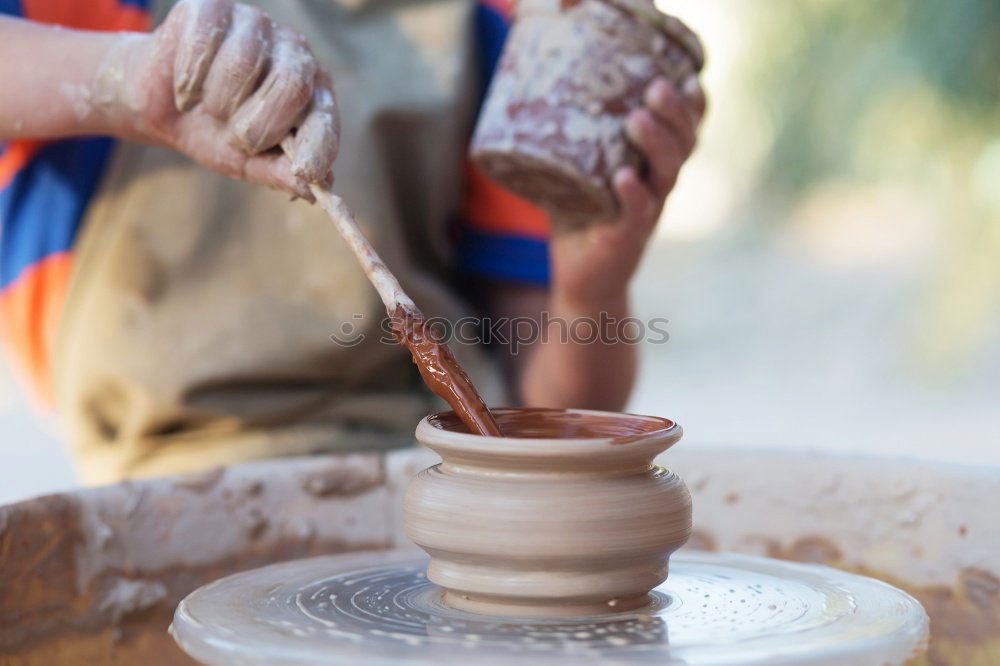 Similar – Potter making the pot in traditional style. Close up.