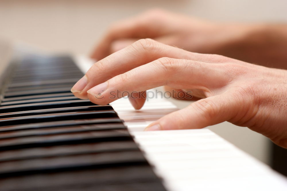 Similar – Image, Stock Photo Close up of hands of person playing piano