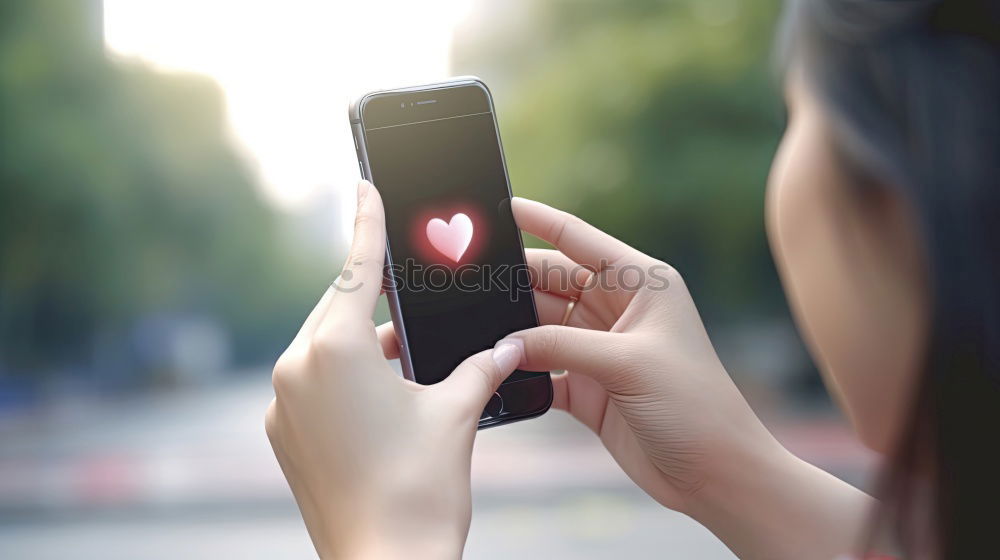 Similar – Image, Stock Photo Young woman is holding smartphone in her hands at the beach