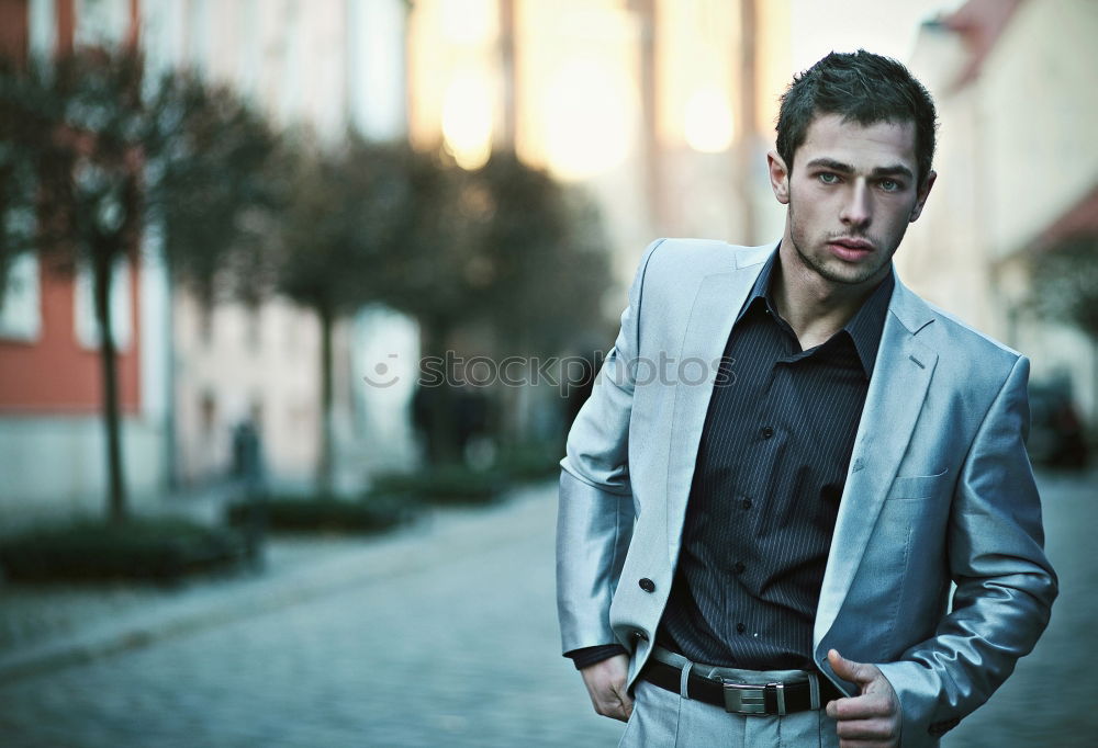 Similar – Thoughtful young man sitting on an urban bench