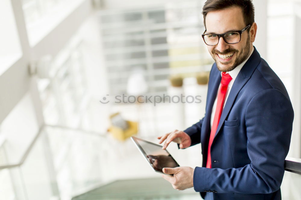 Similar – Image, Stock Photo Handsome businessman with striped tie sits at table with coffee making phone call and using his tablet