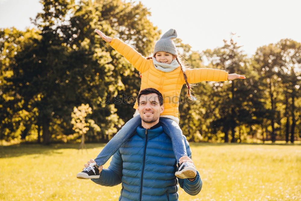 Similar – Image, Stock Photo dad holds his daughter in his arms