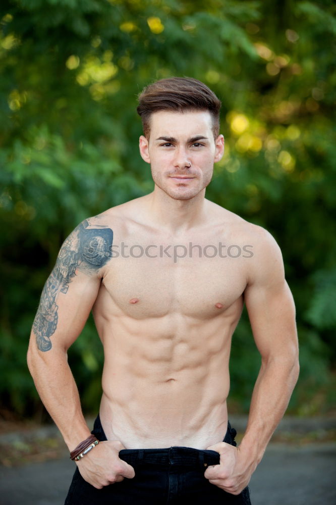 Similar – shirtless muscular man showing abs