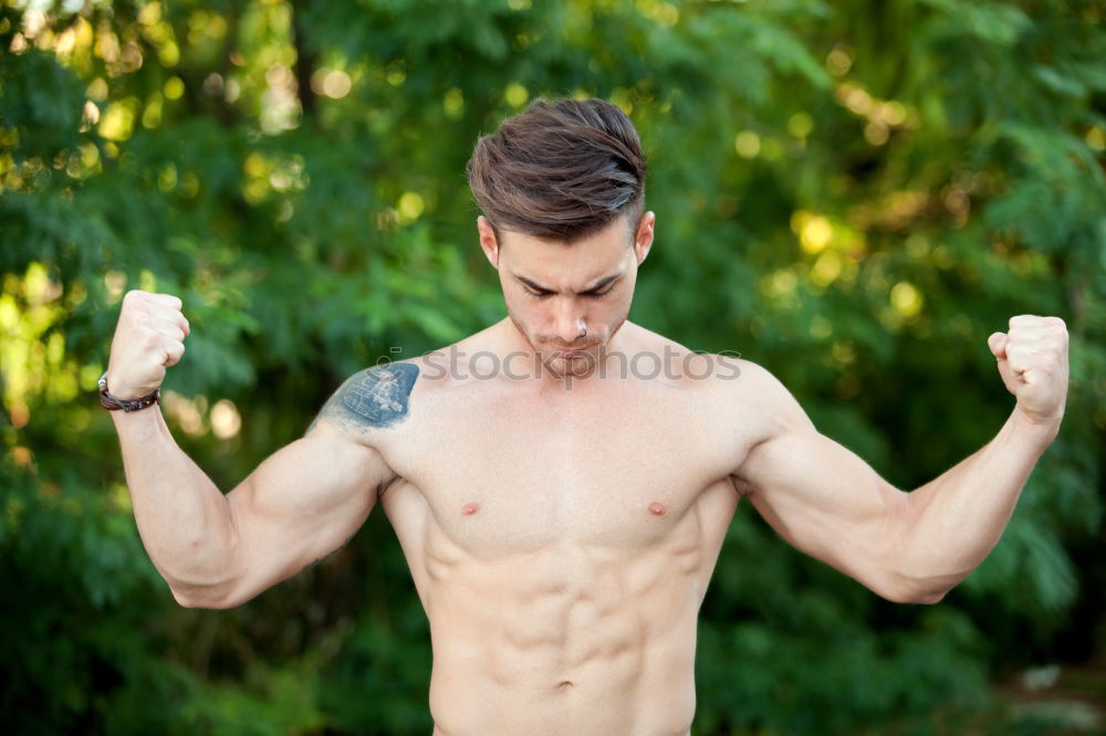 Similar – Young urban athlete warming up before calisthenics training