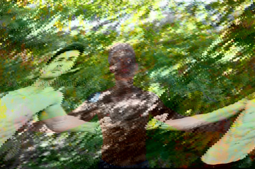 Image, Stock Photo Young bare man in colored smoke outdoors in the forest