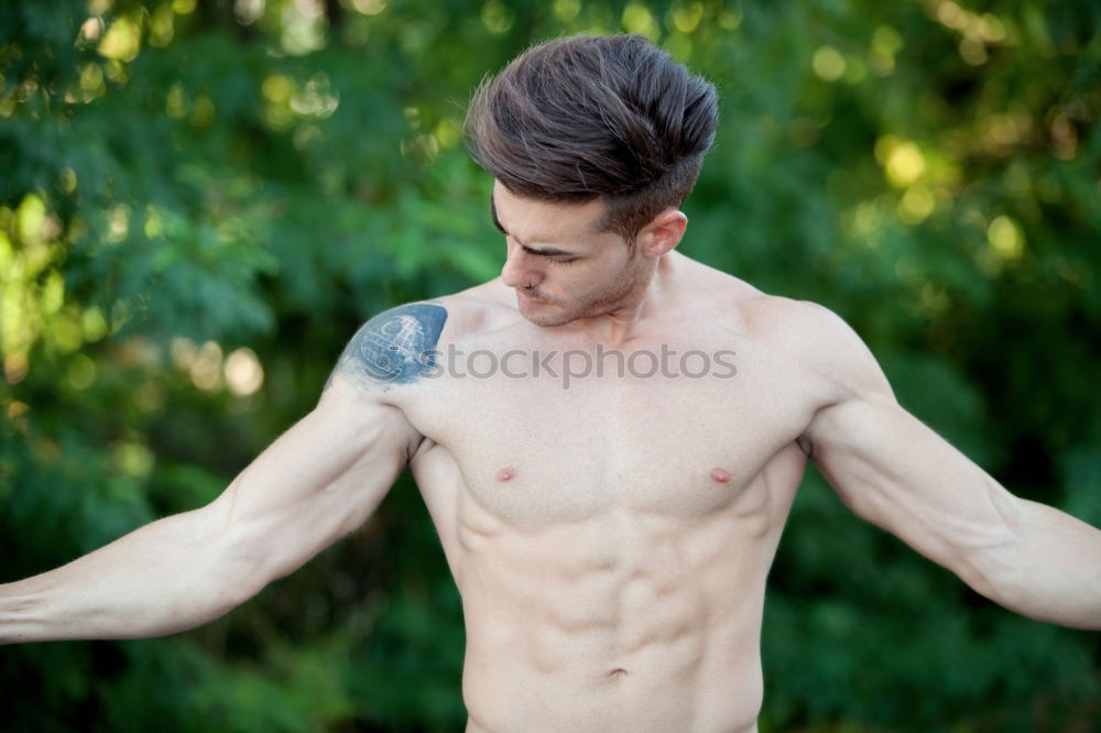 Similar – Young urban athlete warming up before calisthenics training