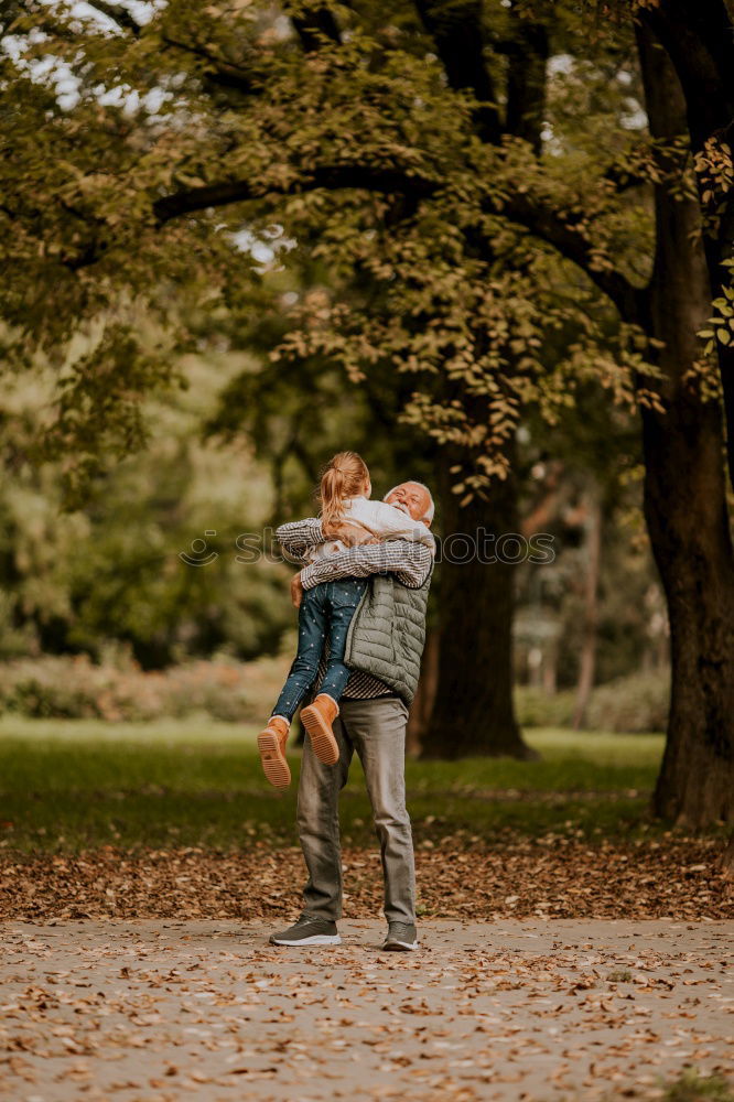 Similar – Child swinging on a tree swing in the forest