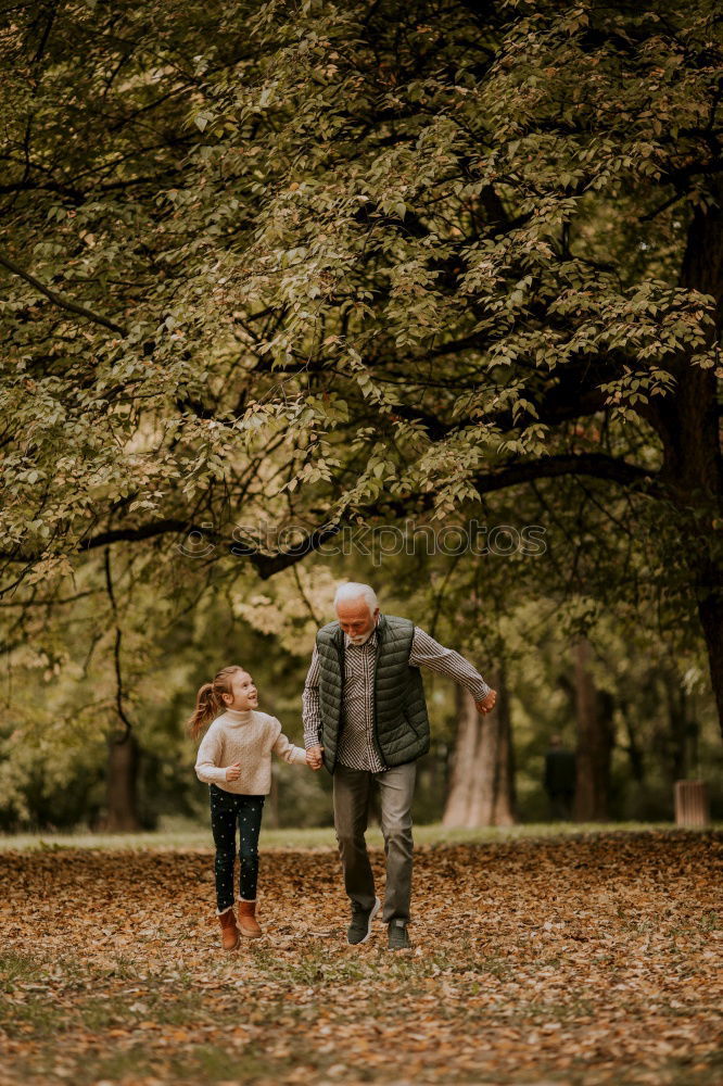 Similar – Happy senior couple on a hike trough green fields