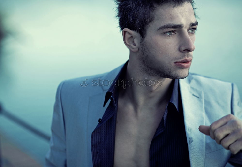 Similar – Image, Stock Photo Young man wearing winter clothes in the street sitting