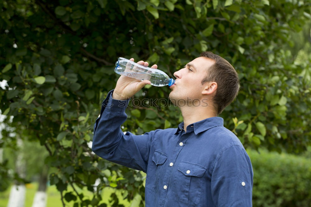 Similar – Fit young woman drinking bottled water