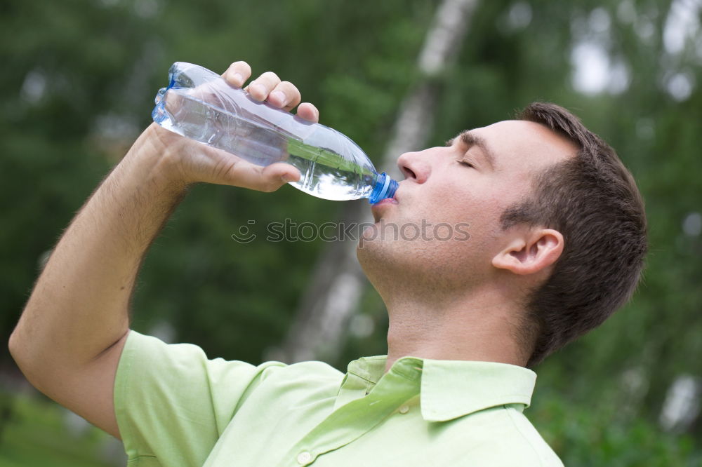 Similar – Fit young woman drinking bottled water