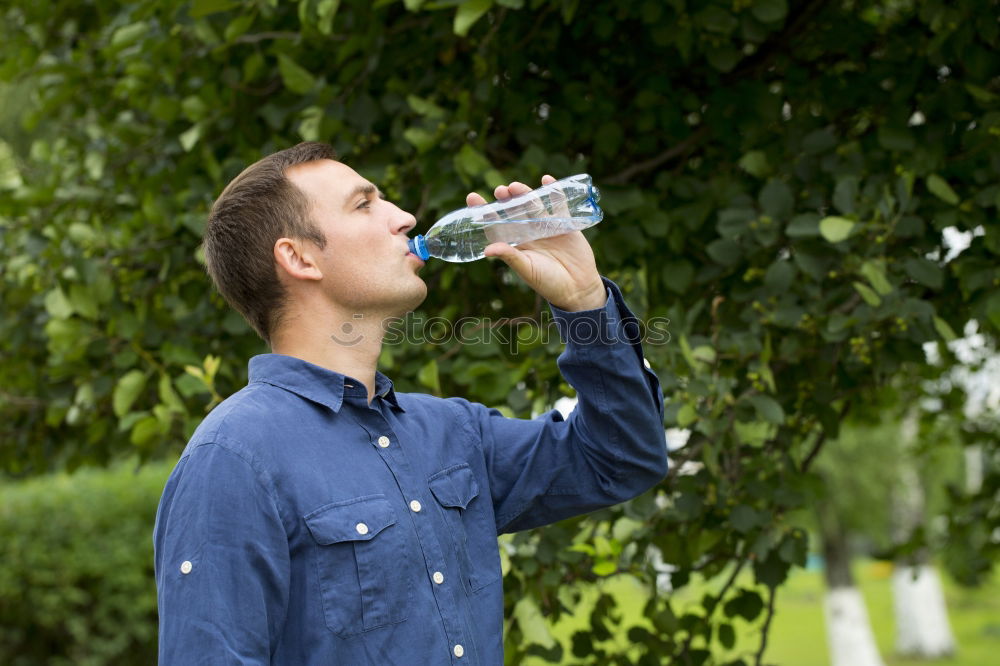 Similar – Fit young woman drinking bottled water