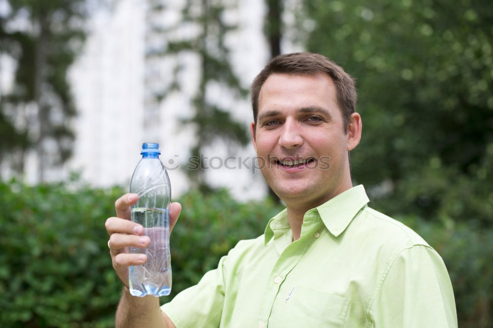 Similar – Young man drinking bottled water