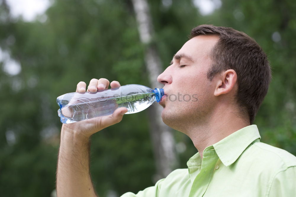 Similar – Fit young woman drinking bottled water