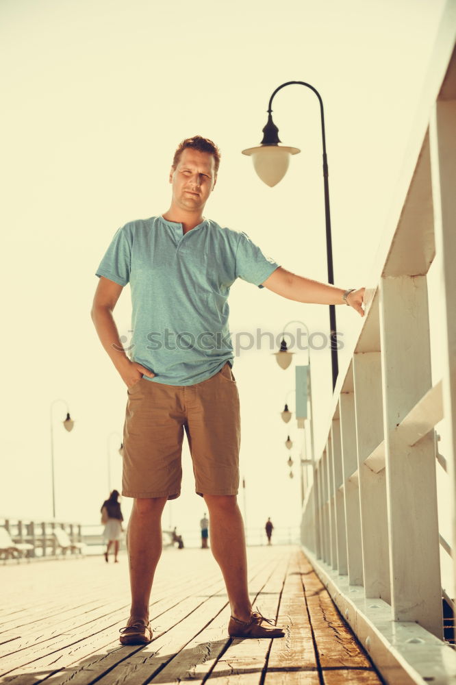 Similar – Portrait of a mature man sitting on steps in the street