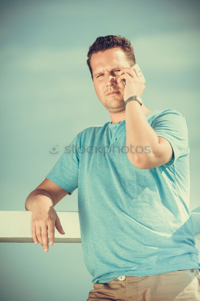 Similar – Smiling happy young man standing on a pier over the sea