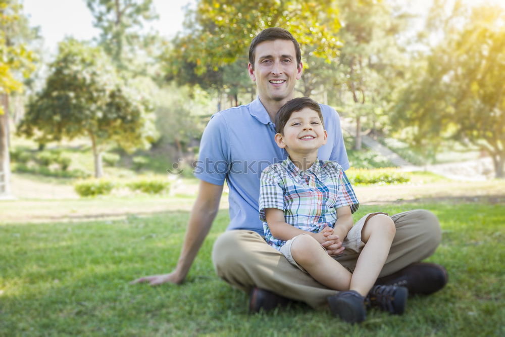 Similar – Image, Stock Photo Father and son playing at the park on bench at the day time.