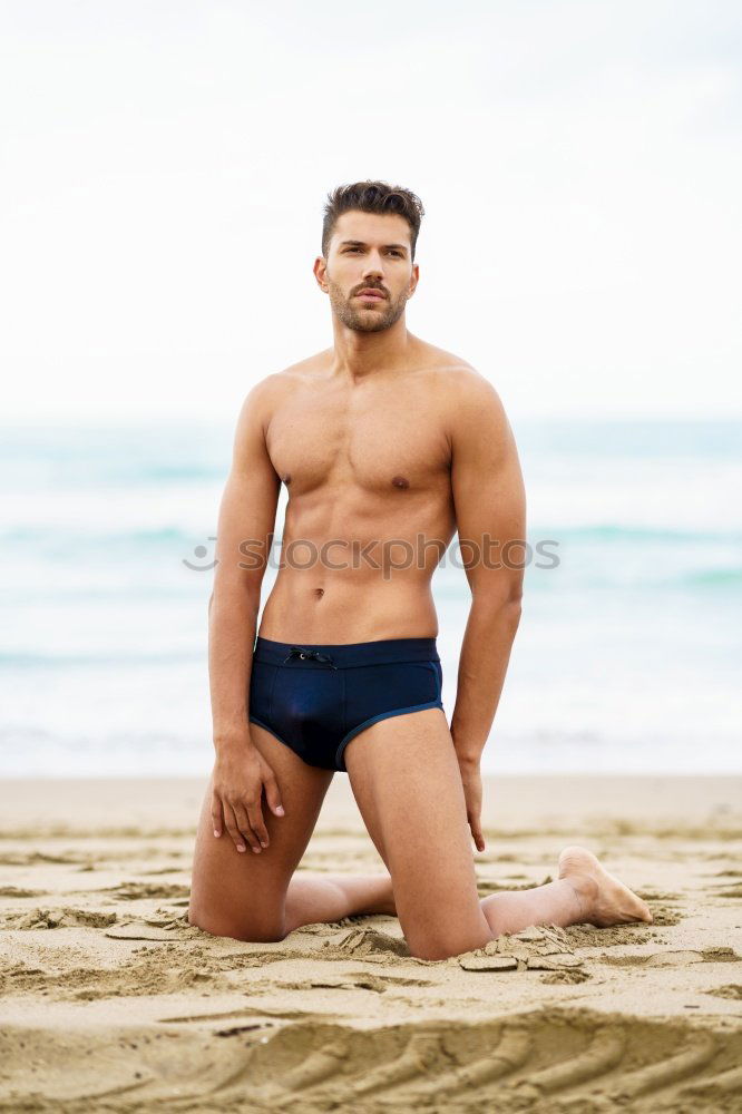 Similar – Handsome muscular man bathing on the beach