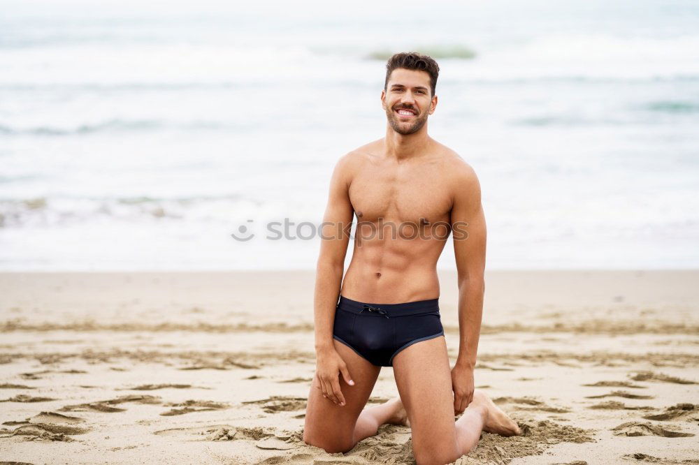 Similar – Handsome muscular man bathing on the beach