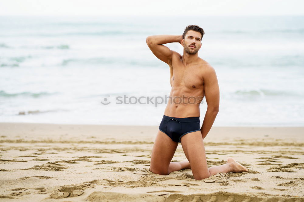 Similar – Handsome muscular man bathing on the beach