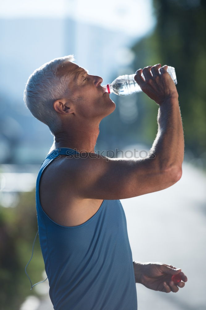Similar – Image, Stock Photo Fit shirtless young black man drinking water after running