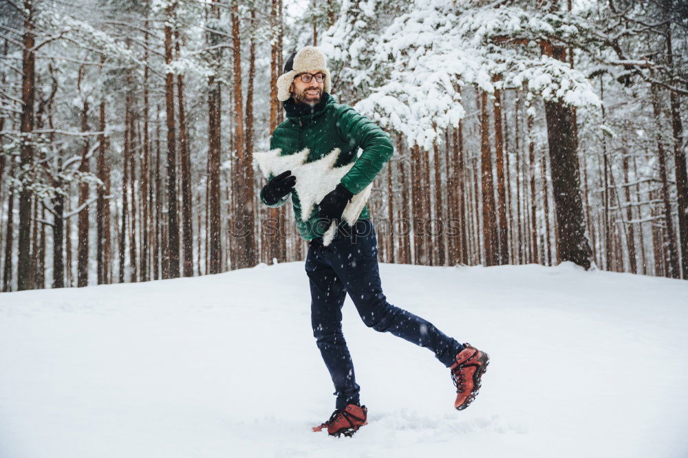 Similar – Image, Stock Photo Woman playing snowballs in woods