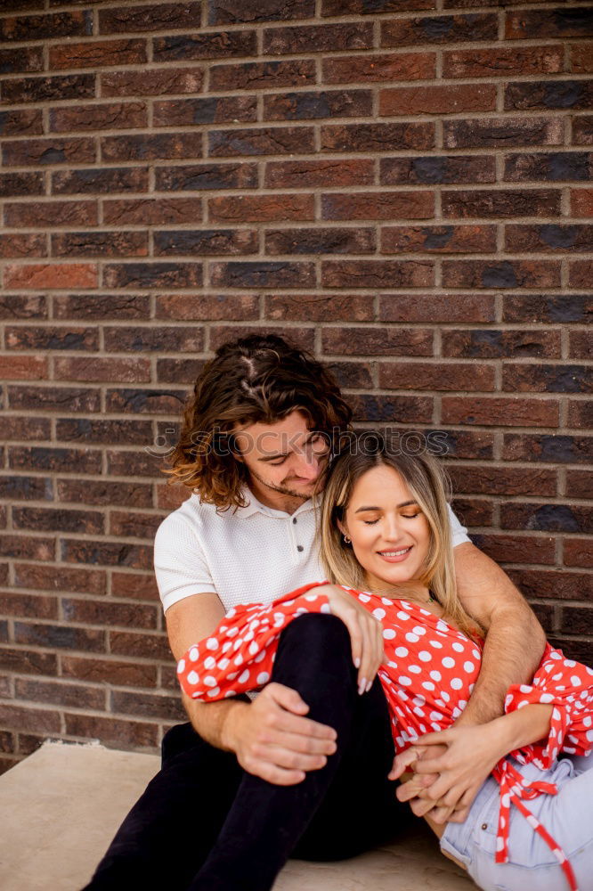 Similar – Image, Stock Photo Kissing couple at stone wall with metal decorated bars