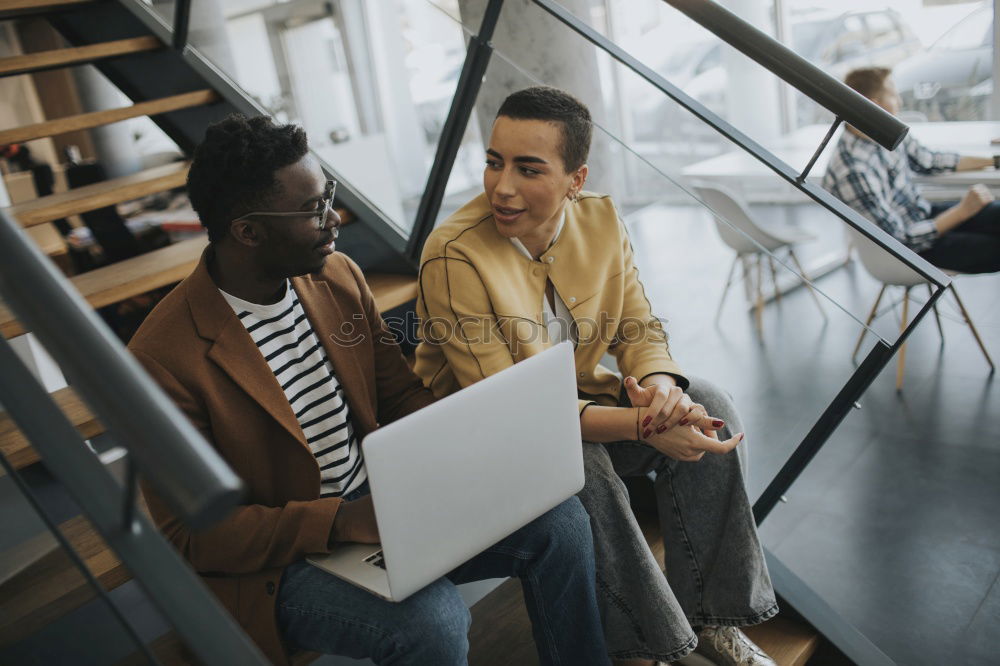 Similar – Group of young adults having a meeting in the office