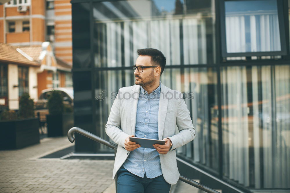 Similar – Image, Stock Photo Young smiling man looking at his smart phone outdoors