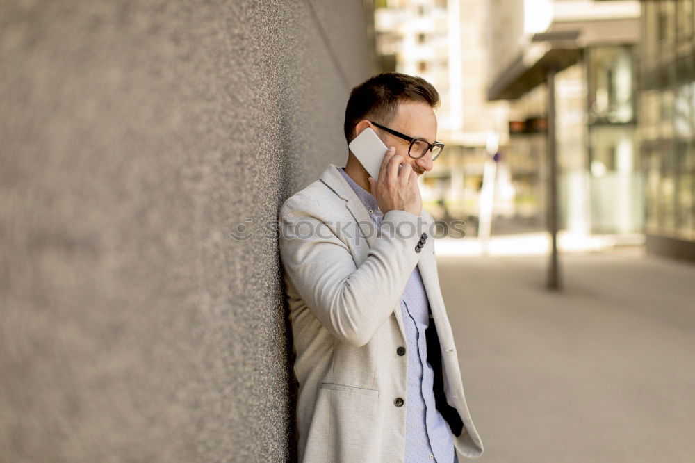 Similar – Image, Stock Photo Modern young man with mobile phone in the street.
