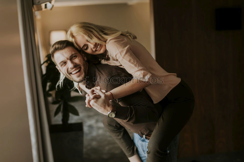 Similar – Couple embracing on evening street