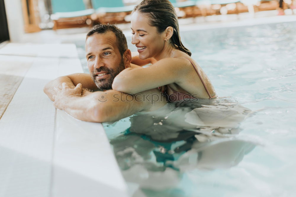 Similar – Image, Stock Photo Woman with orange swimsuit in pool