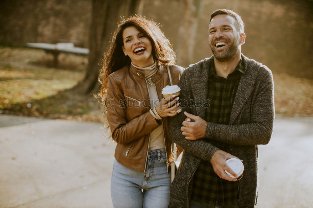 Similar – Young couple taking selfie photo with smartphone outdoors