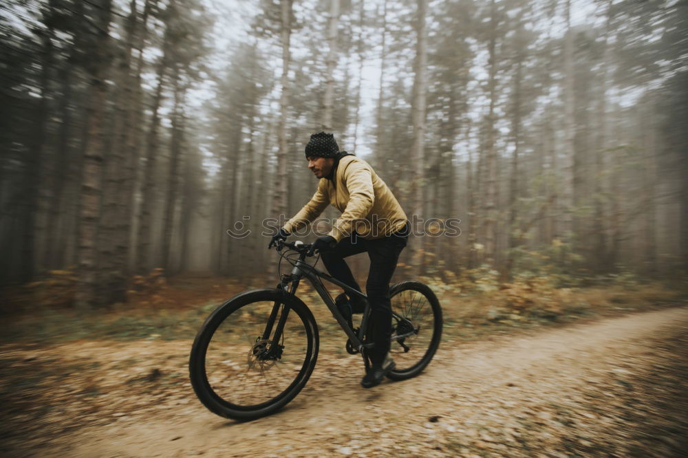 Similar – Cyclist Riding a bike at sunset. Sports