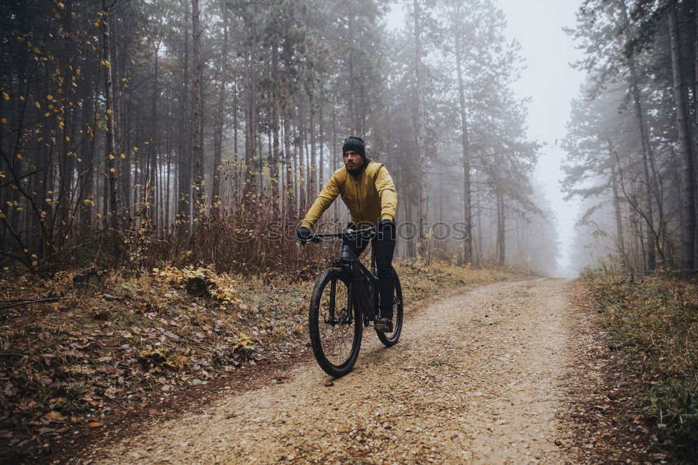 Similar – Cyclist Riding a Bike at sunset. Sports