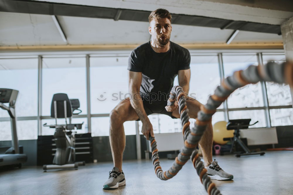 Similar – Woman training with ropes