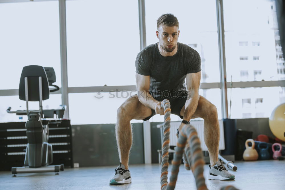 Similar – Image, Stock Photo Man setting control panel of treadmill for training